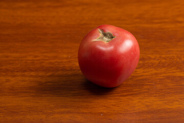 There are fresh tomatoes on the table