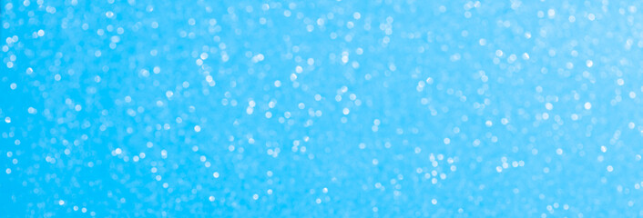 sparkles of Blue glitter abstract background. Copy space
