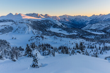 Rock Isle Lake, Sunshine Meadows cold sunset under blanket of snow in winter, Canada