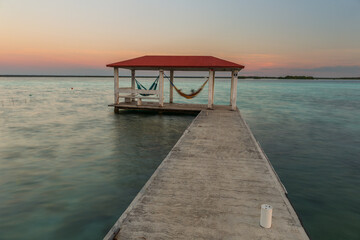 Obraz premium Caribbean sunset scene at Bacalar lagoon, Mexico