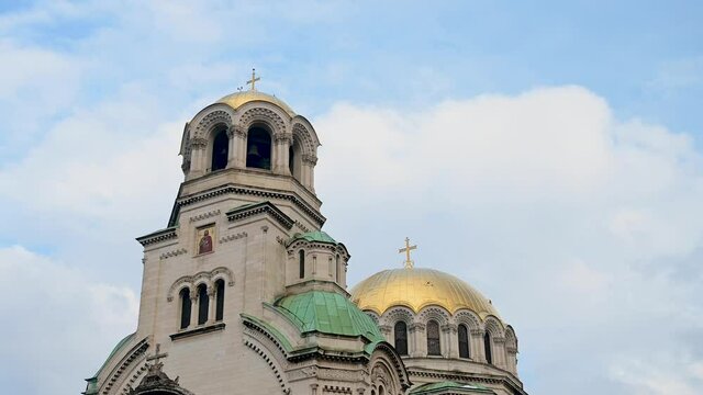 Time lapse of Orthodox church and cloudy sky. Cathedral in Sofia, Bulgaria. A gold dome of church.