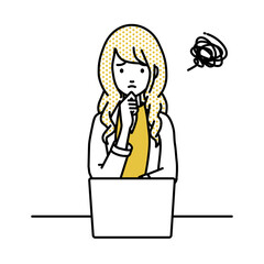 デスクで座ってPCを開いて困っているジャケットの女性