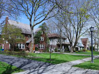 Suburban residential street with traditional two story houses