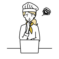 デスクで座ってPCを開いて困っている調理師の女性