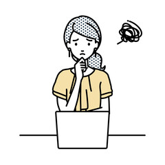 デスクで座ってPCを開いて困っているオフィスカジュアルの女性