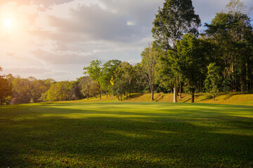 Obraz na płótnie Canvas Golf course with a rich green turf beautiful scenery.