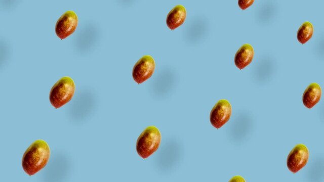 Colorful fruit pattern of fresh mango on blue background with shadows. Seamless pattern with mango. Realistic animation. 4K video motion