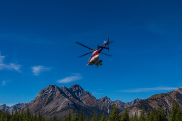 Plakat Helicopter takeoff in the mountains