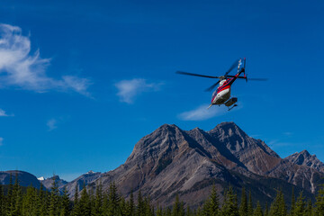Plakat Helicopter takeoff in the mountains
