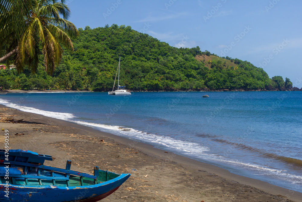 Wall mural blue boat on the beach