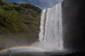 Beautiful aerial view of the huge Skogafoss waterfall and its rainbow in summer. Icelands Waterfal