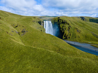 Beautiful aerial view of the huge Skogafoss waterfall and its rainbow in summer. Icelands Waterfal