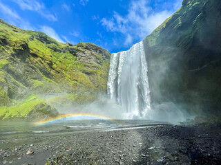 Beautiful aerial view of the huge Skogafoss waterfall and its rainbow in summer. Icelands Waterfal