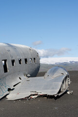 Impressive view of the Sólheimasandur Plane Wreck, the Remains of a 1973 U.S. Navy DC plane that crashed on black sand beach in Iceland