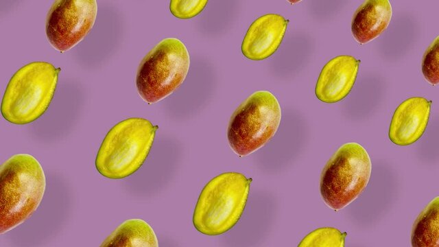 Colorful fruit pattern of fresh mango on pink background with shadows. Seamless pattern with mango. Realistic animation. 4K video motion