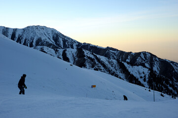 Naklejka na ściany i meble Active lifestyle and sports: rest in a ski resort. Skiing, snowboarding. Nice alpine view.