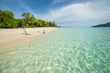 Mantabuan island with turquoise water on a sunny day, Borneo