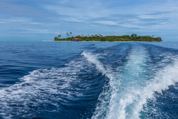 Mantabuan island with turquoise water on a sunny day, Borneo