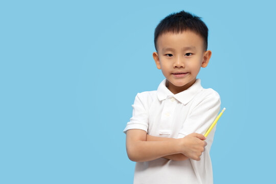 Smart Kid Crossing Arms And Holding Pencil