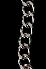 Silver chain isolated on black background.