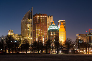 Detailed night view of the skyline of The Hague, near central station, as seen from park Malieveld...