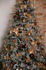 beautiful christmas tree decorated with toys and garland of lights