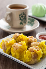 Siu Mai - Chinese steamed pork dumplings in bamboo steamers. Dim Sum