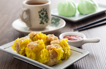 Siu Mai - Chinese steamed pork dumplings in bamboo steamers. Dim Sum