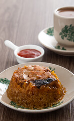 Dim Sum Loh Mai Kai. Steamed Glutinous Rice with chicken mushrooms and sausage