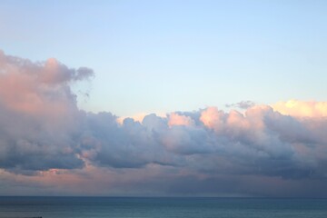 Dark clouds over the sea, sunset time in winter season