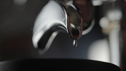 rinsing coffee machine with double spout portafilter closeup