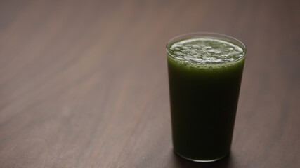 matcha drink in tumbler glass on table