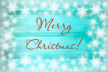 Winter wooden green mint turquoise nature background with snowflakes two sides. Texture of painted wood horizontal boards. Merry Christmas card.
