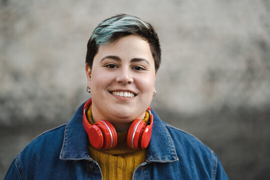 Handsome Non-binary Woman Smiling Outdoors