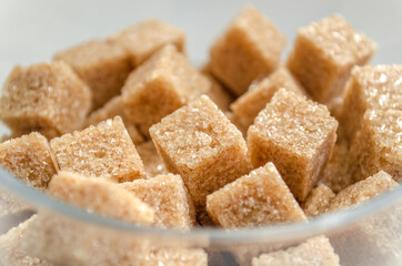 Brown sugar cubes in a glass