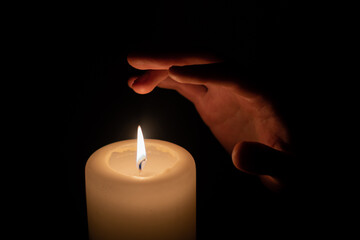 burning candle in the dark