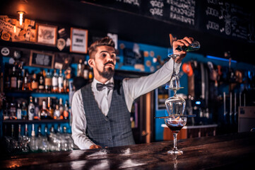 Bartender concocts a cocktail on the porterhouse