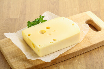 Maasdam cheese over the board