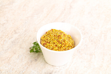 Grain mustard sauce in the bowl