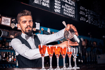 Confident barman surprises with its skill bar visitors at the night club