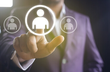 Close up of businessman hand touching at business icons.Human Resources concept.