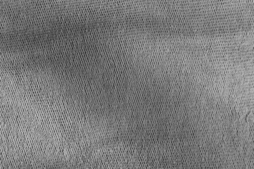 Fototapeta na wymiar Grey canvas background. The surface of the texture of the grey fabric.