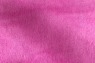 The texture and pattern of the old pink cloth is blurry.