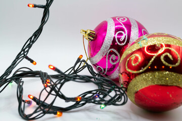 Beautiful Christmas toys and a garland with a blurred background.