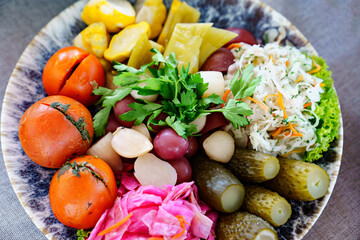assorted salted and pickled vegetables on a plate. 