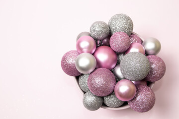 Pink and silver ornaments on pink background
