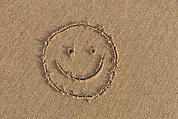 A painted smile in the sand.