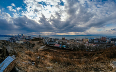 view of the city at sunset from hill