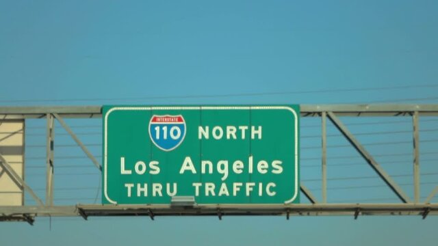 Car POV on road sign in Los Angeles in slow motion 120fps