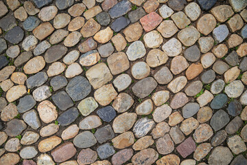 Old rounded cobblestone pavement in old town of Freiburg im Breisgau, Baden-Wuerttemberg, Germany